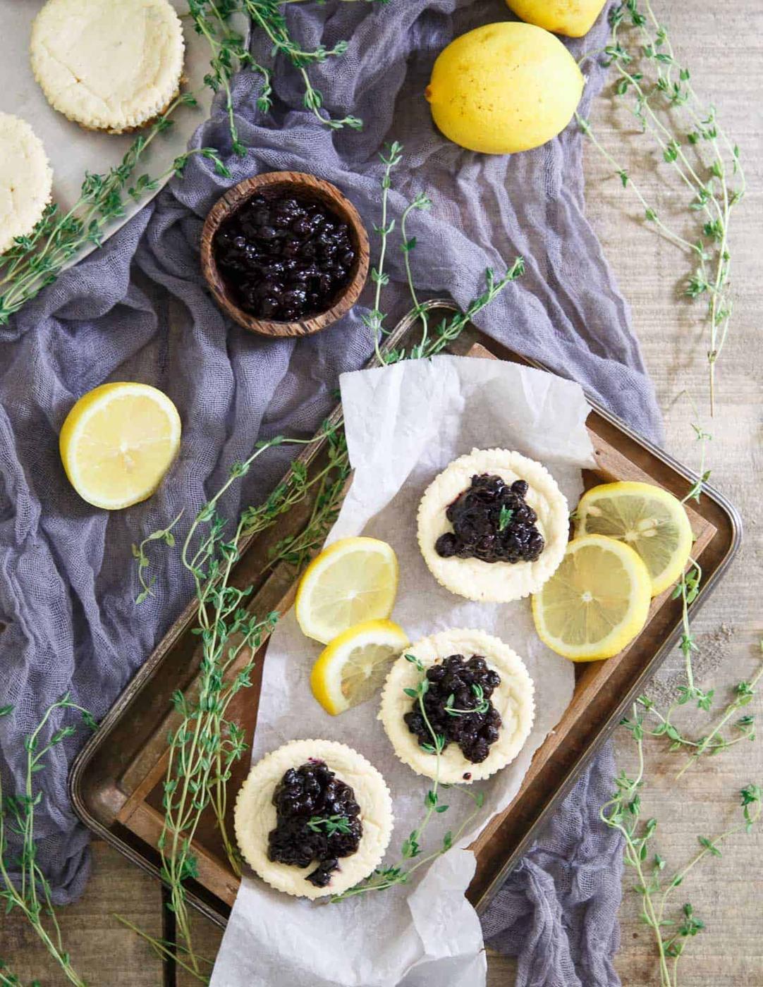 Lemon Thyme Blueberry Mini Cheesecakes are a delicious gluten free sweet bite