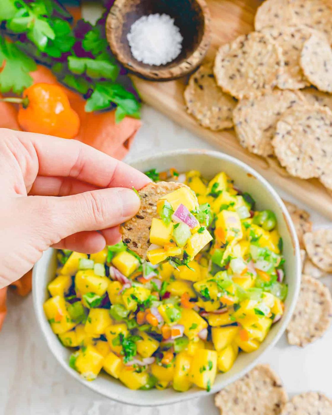 Mango habanero salsa on a cracker.