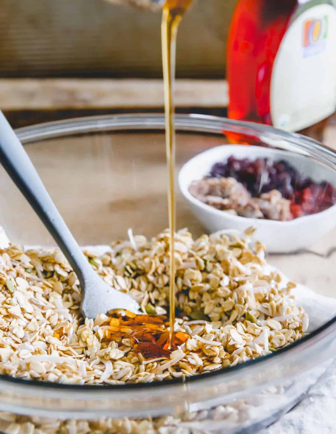making nut free granola using gluten-free oats, coconut flakes, pepitas, sunflower seeds and buckwheat groats