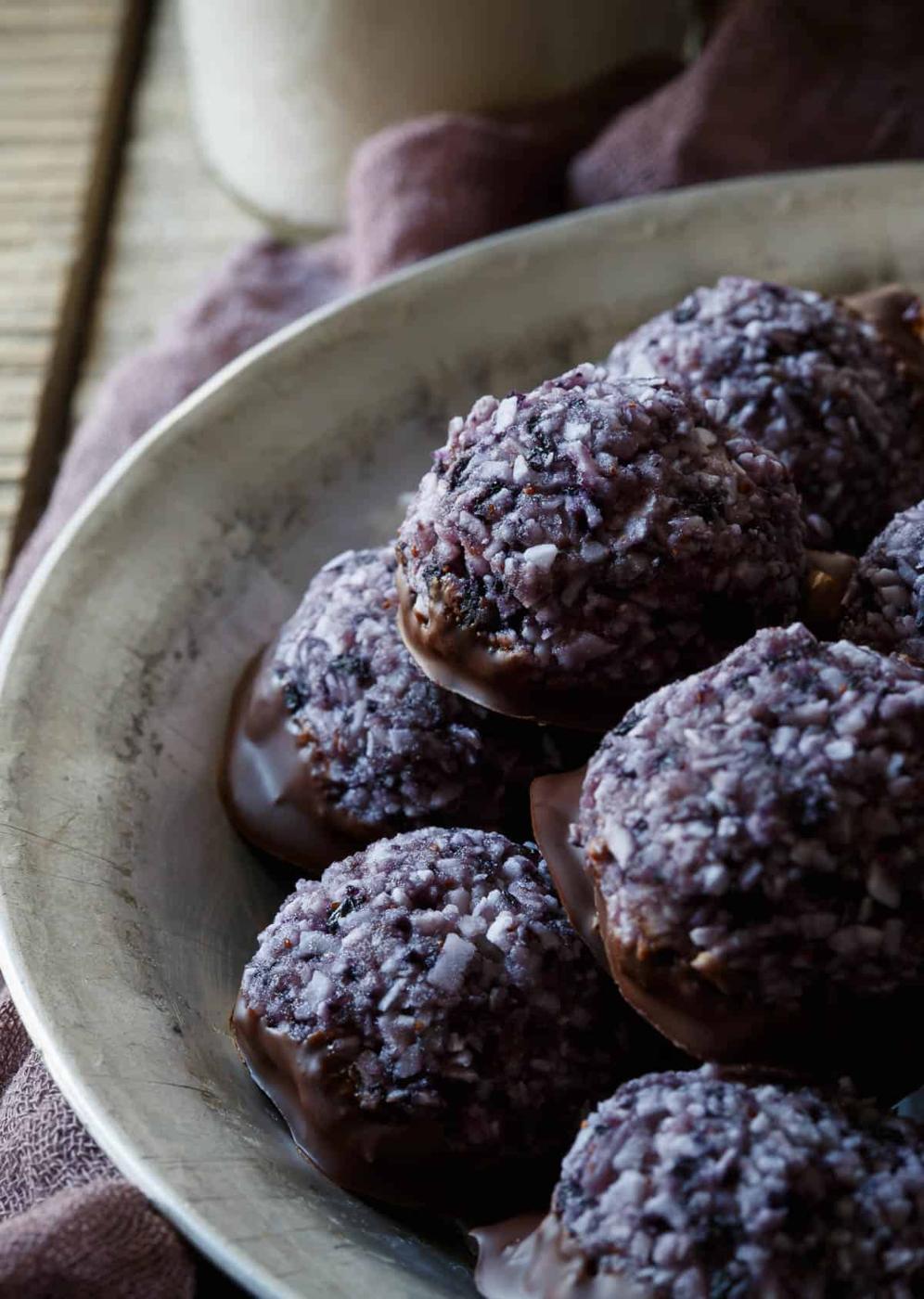 These Paleo Blueberry Chocolate Macaroons are made with wild blueberries and dipped in dark chocolate for a quick and easy dessert!