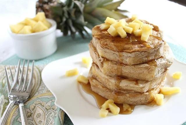 Try a stack of these battered pineapple pancake rings for breakfast, a delicious combination of pancakes and fruit.