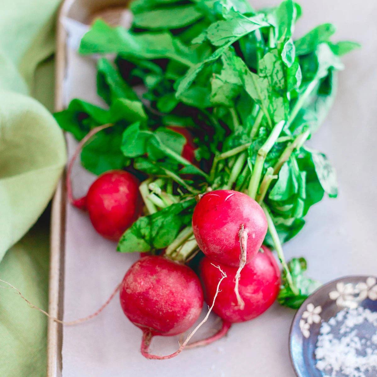 Spring time radishes are roasted and added to this creamy pea risotto.