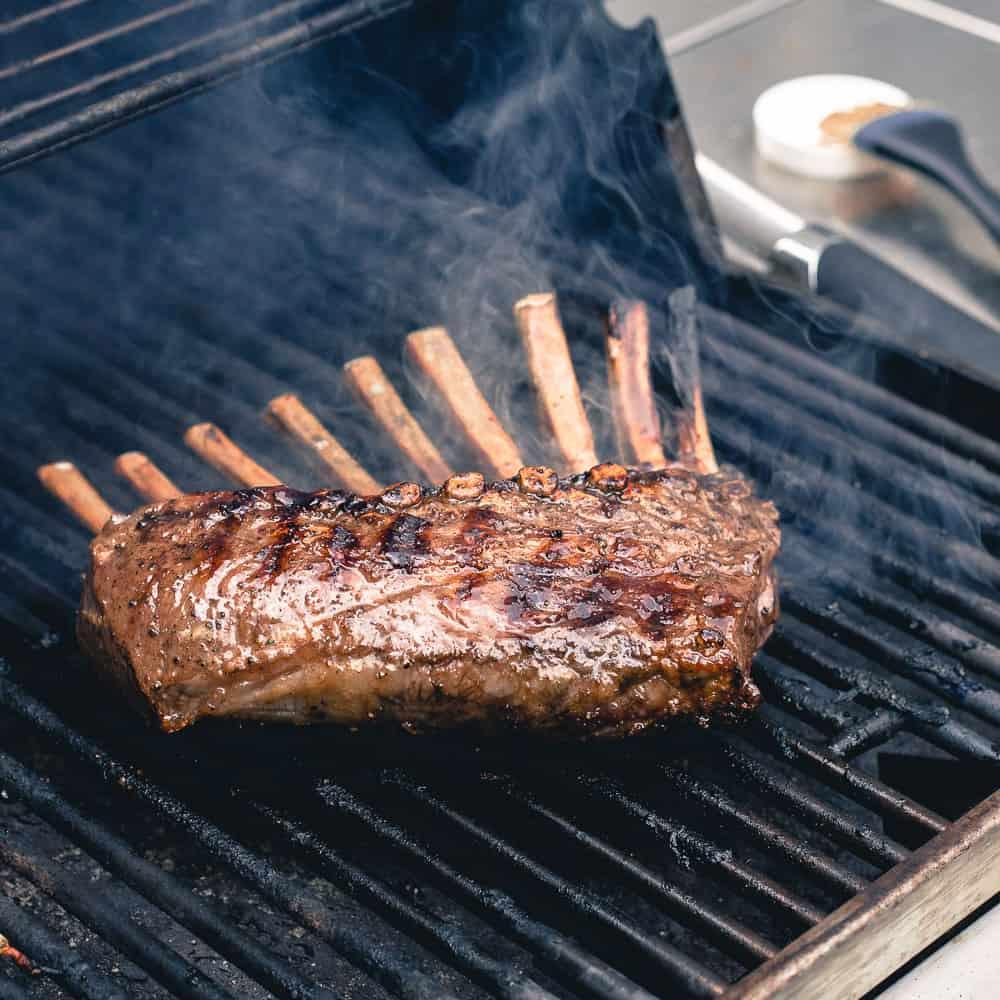 Peach honey glazed lamb chops are grilled to perfection for a delicious summer meal.