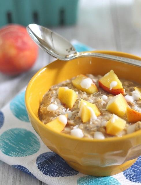Stove top oatmeal with peaches and cream using coconut milk.