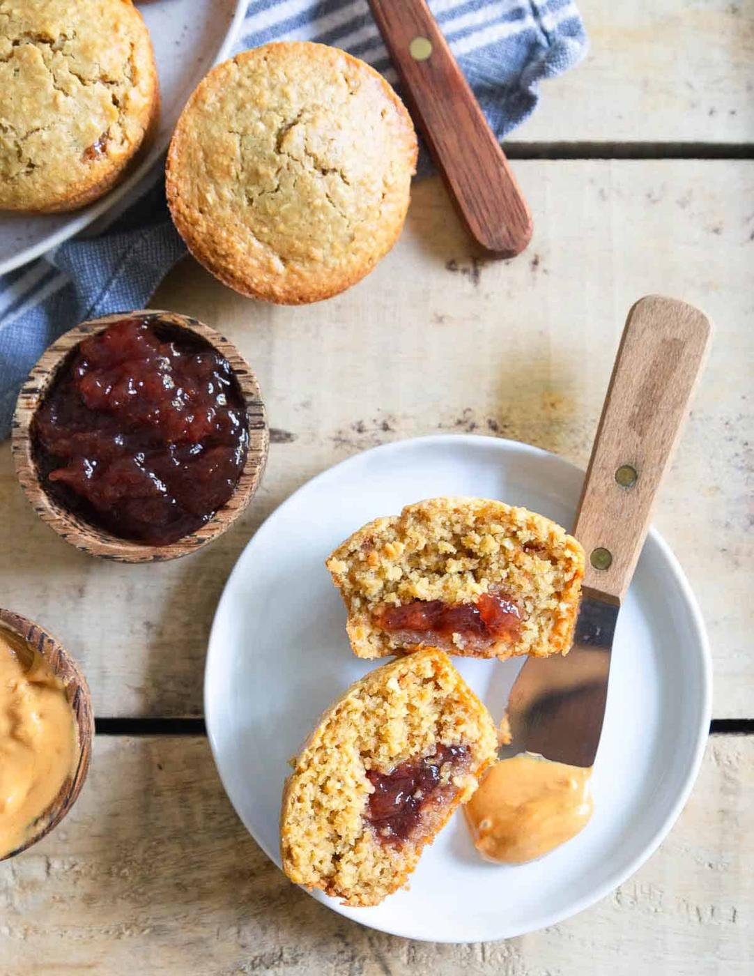 Peanut butter and jelly muffins made with gluten-free oat flour are a tasty afternoon treat!
