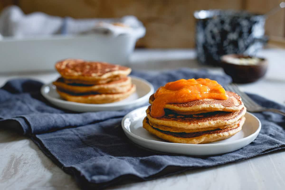 Almond persimmon pancakes topped with persimmon puree are the best way to do breakfast on a cold winter morning.