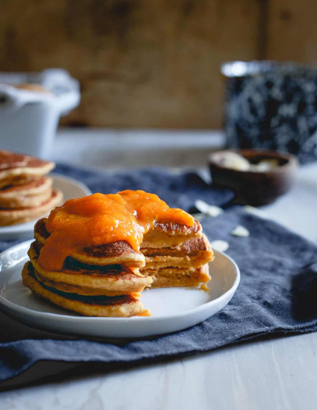 This stack of almond persimmon pancakes is full of flavor, slightly sweet, hearty and perfect for a winter breakfast.