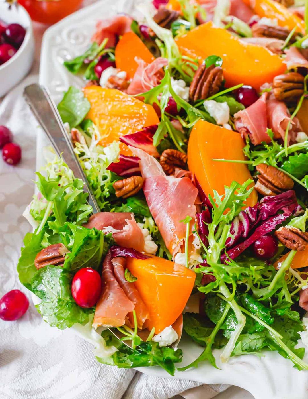 Baby greens, frisée and radicchio with persimmons, prosciutto, cranberries, goat cheese and pecans.