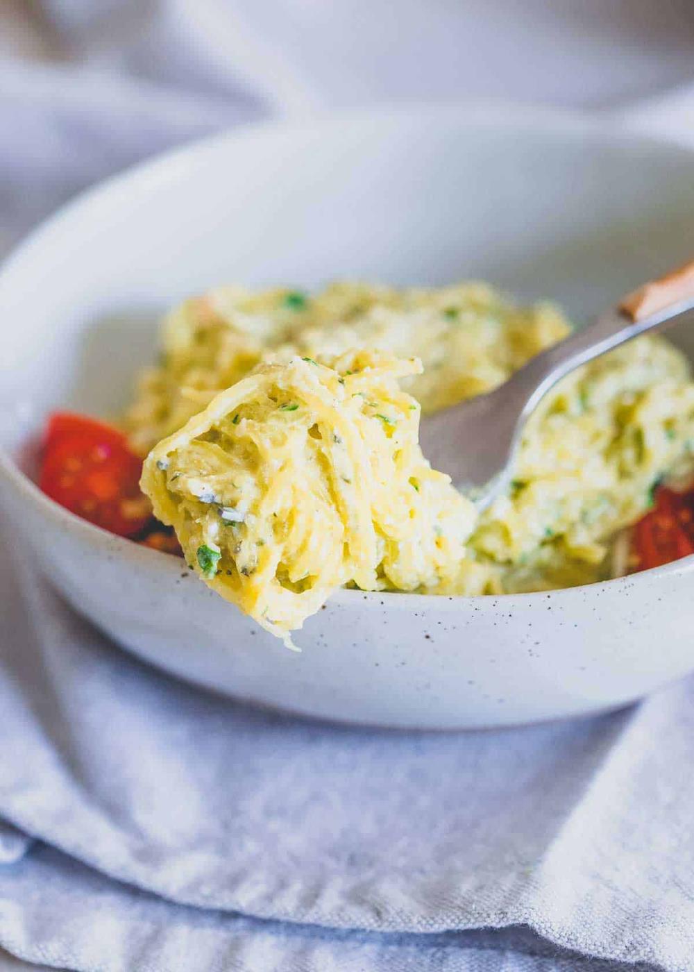 Creamy pesto spaghetti squash noodles are a light and healthy version of a classic comforting pasta dish.