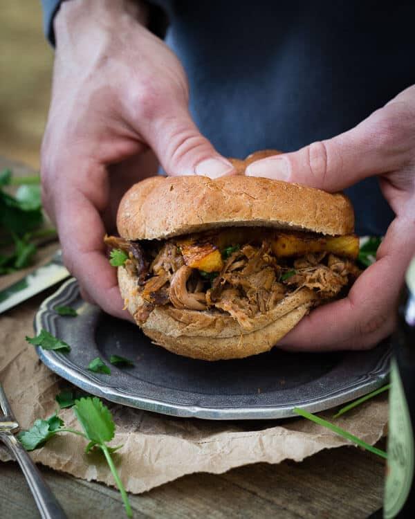 These BBQ pork sandwiches are topped with pickled pineapples.