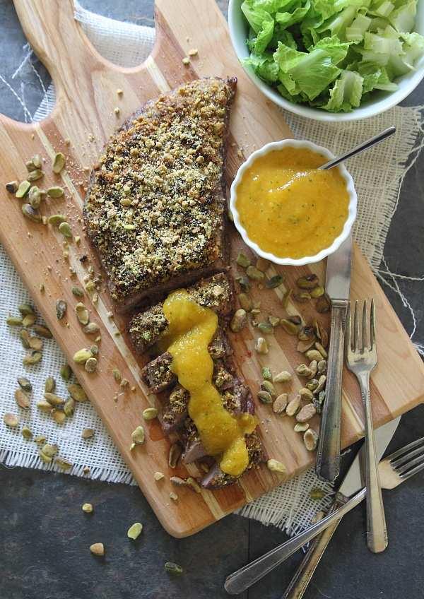 This pistachio crusted flank steak topped with a simple peach puree is healthy yet delicious.