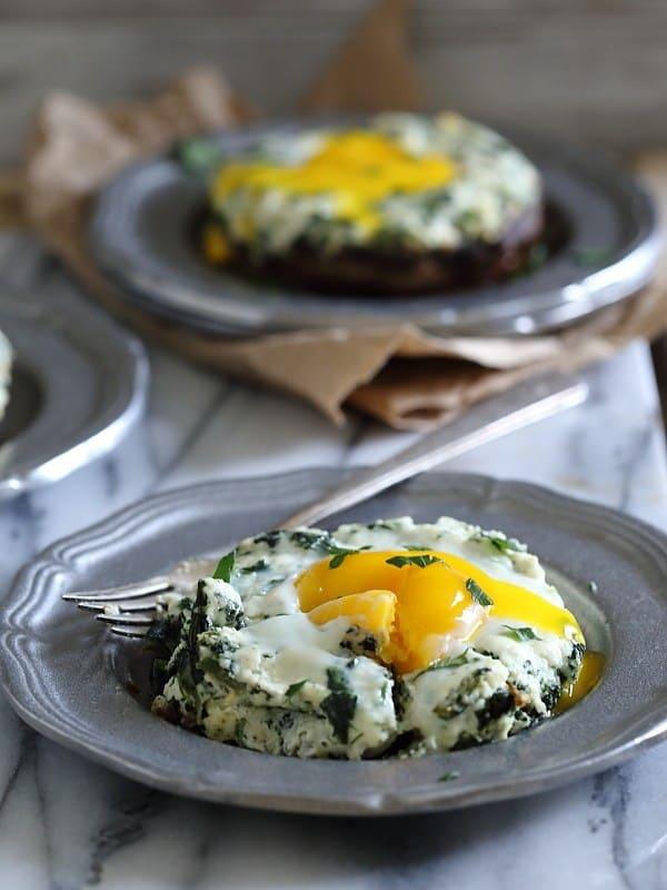 These portobello mushrooms are stuffed with a ricotta spinach mixture and finished with a runny egg that's baked right on top. They're a perfect quick dinner or savory breakfast.