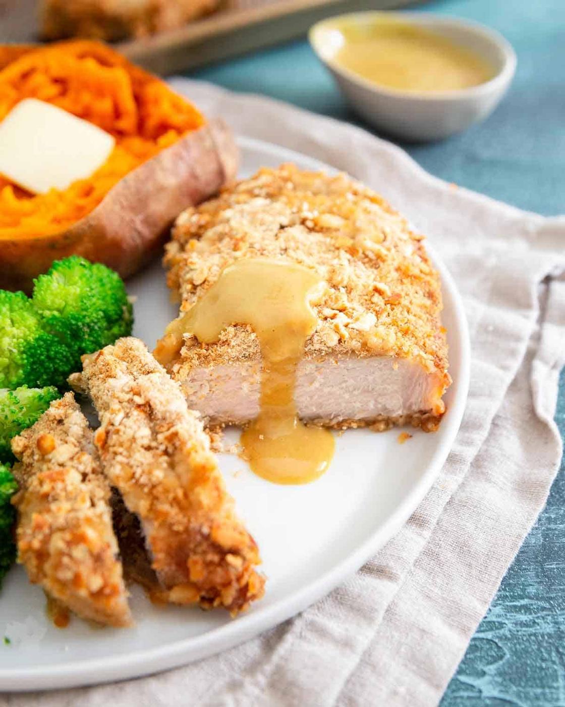 Serve pretzel baked pork chops with an easy steamed vegetable and sweet potato for a healthy weeknight dinner.