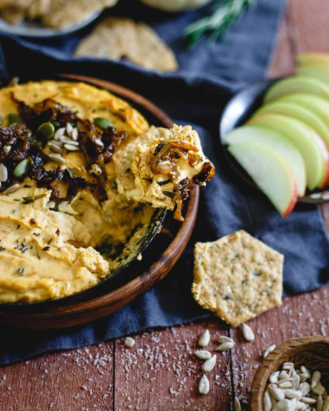 You can serve this pumpkin goat cheese dip with caramelized onions hot or cold. Makes a great addition to any holiday party spread!