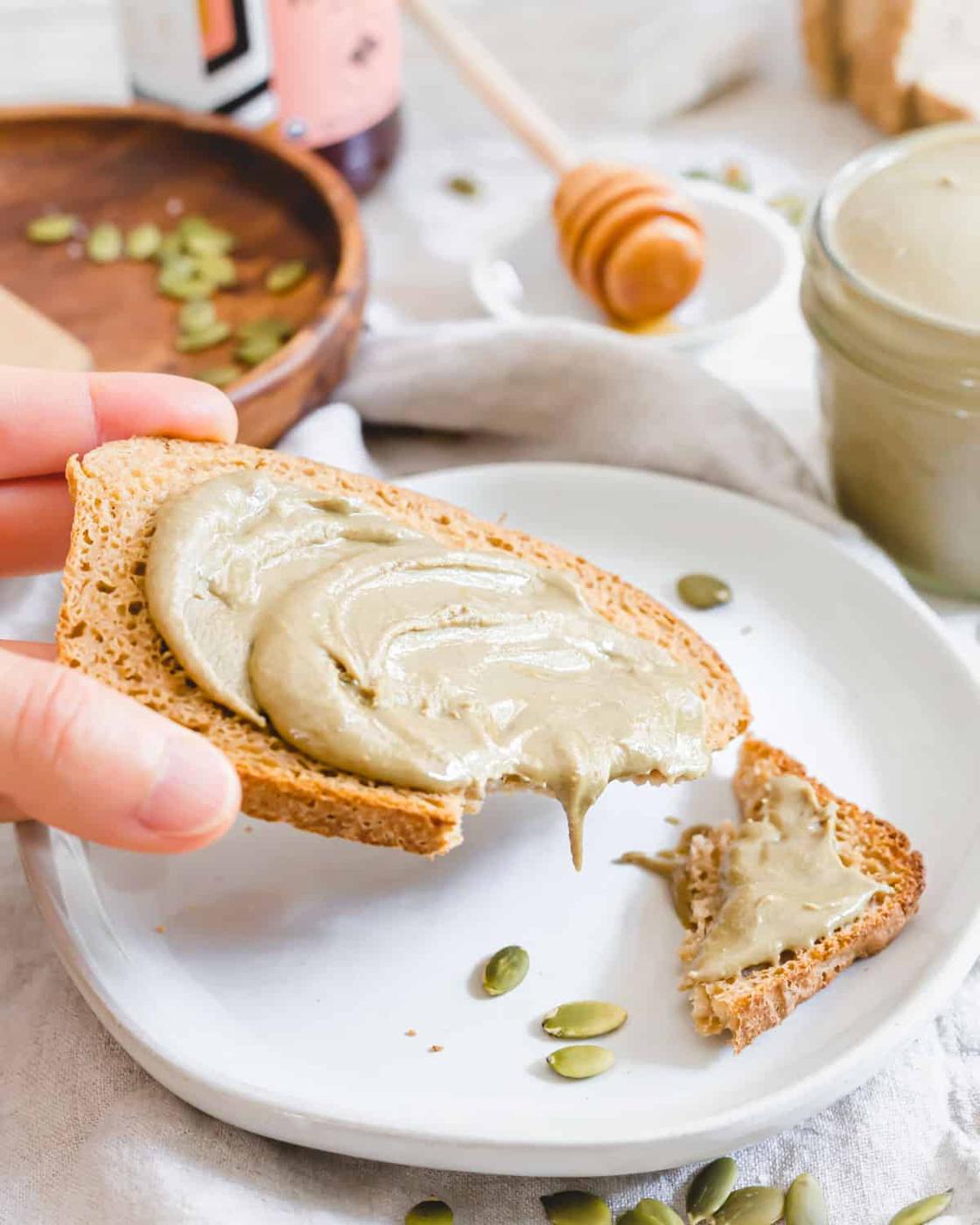 Toasted gluten-free sourdough bread with a smear of allergy-friendly homemade pumpkin seed butter.