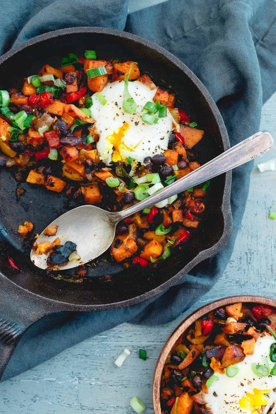 With a couple runny eggs on top, this harissa sweet potato hash is simple, spicy and perfect for a quick meal any time of day!