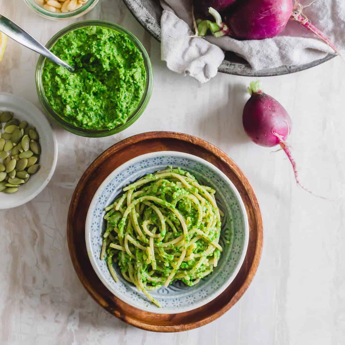 Dairy-free radish green pesto tossed with spaghetti.