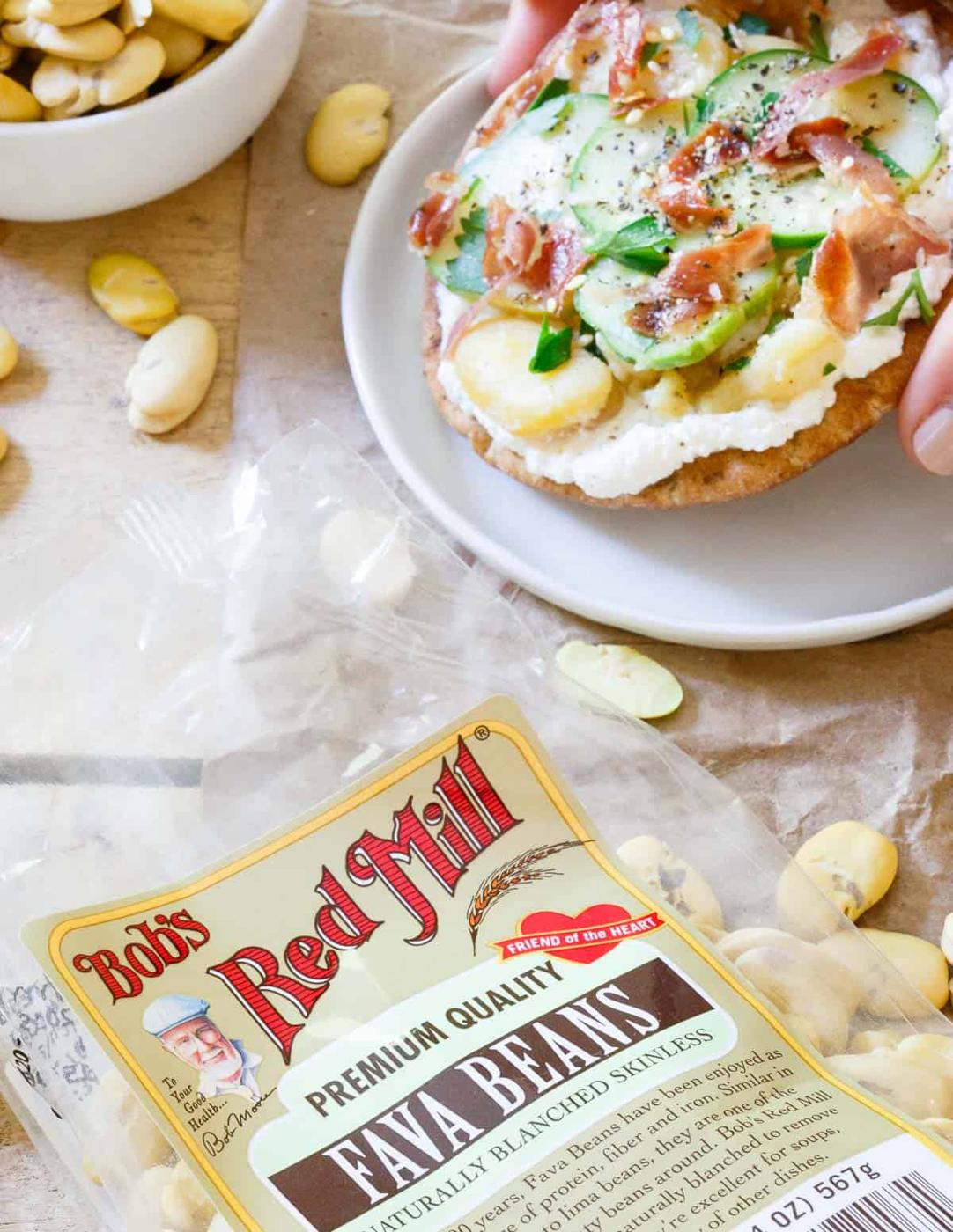 Creamy ricotta, buttery smashed fava beans, tangy cucumbers and salty prosciutto make these fava bean grilled pita bites an amazing light lunch or appetizer.