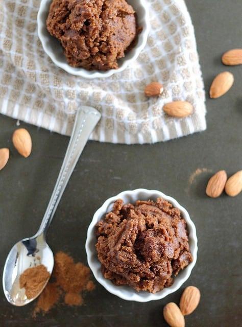 Top view of two small bowls of pumpkin pecan butter.