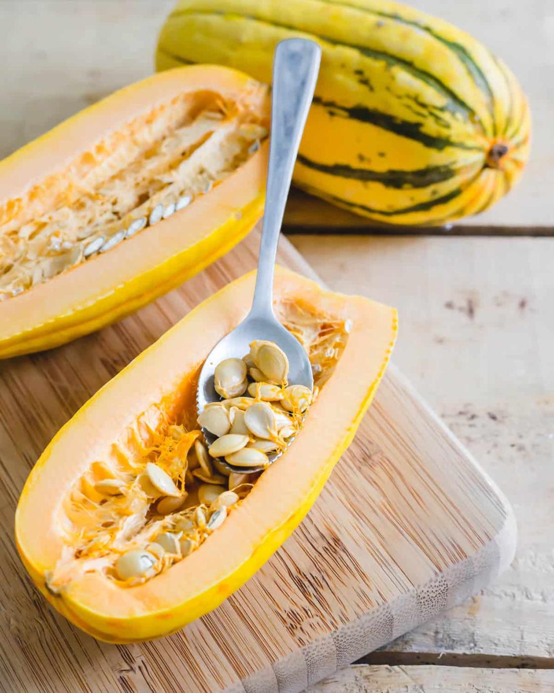 Seeding delicata squash with a grapefruit spoon.