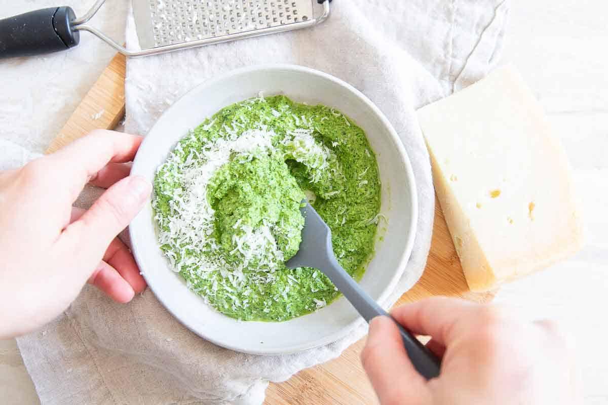 This easy basil, spinach, watercress pesto gets tossed with crispy roasted potatoes for an easy side dish that goes with everything!