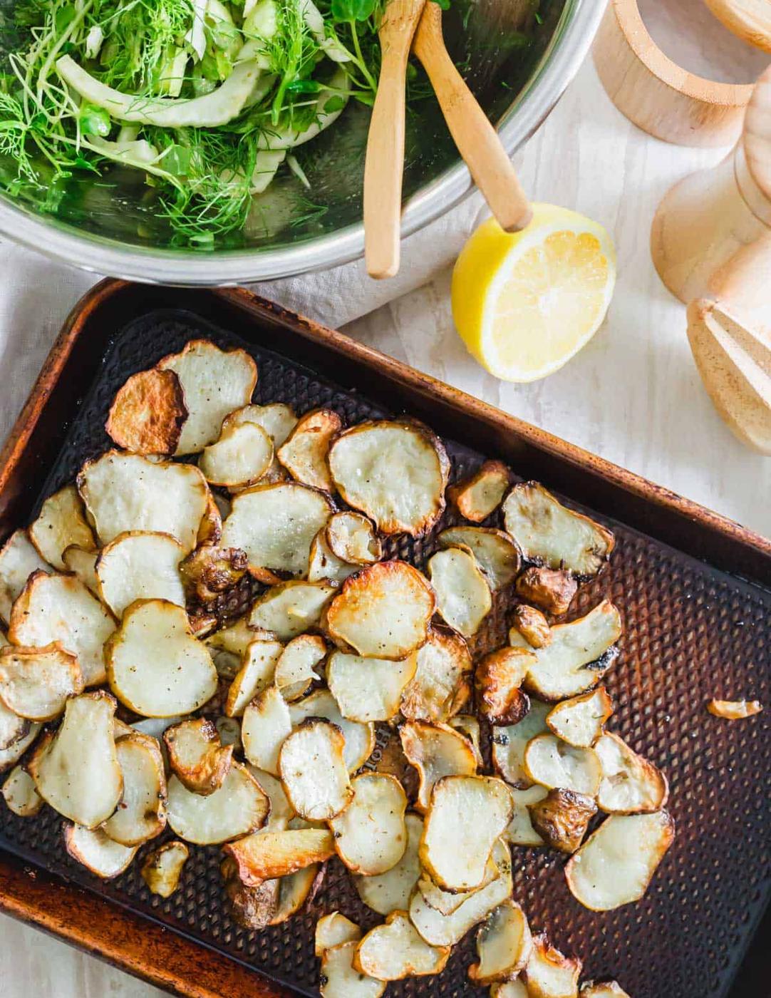 Crispy roasted sunchokes on a baking sheet straight out of the oven.