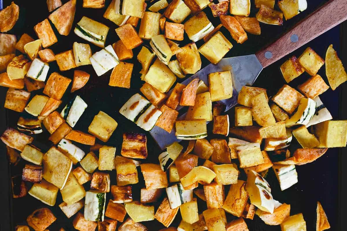 Roasted sweet potato and delicata squash bring a vegetarian heartiness to this fall chickpea salad.