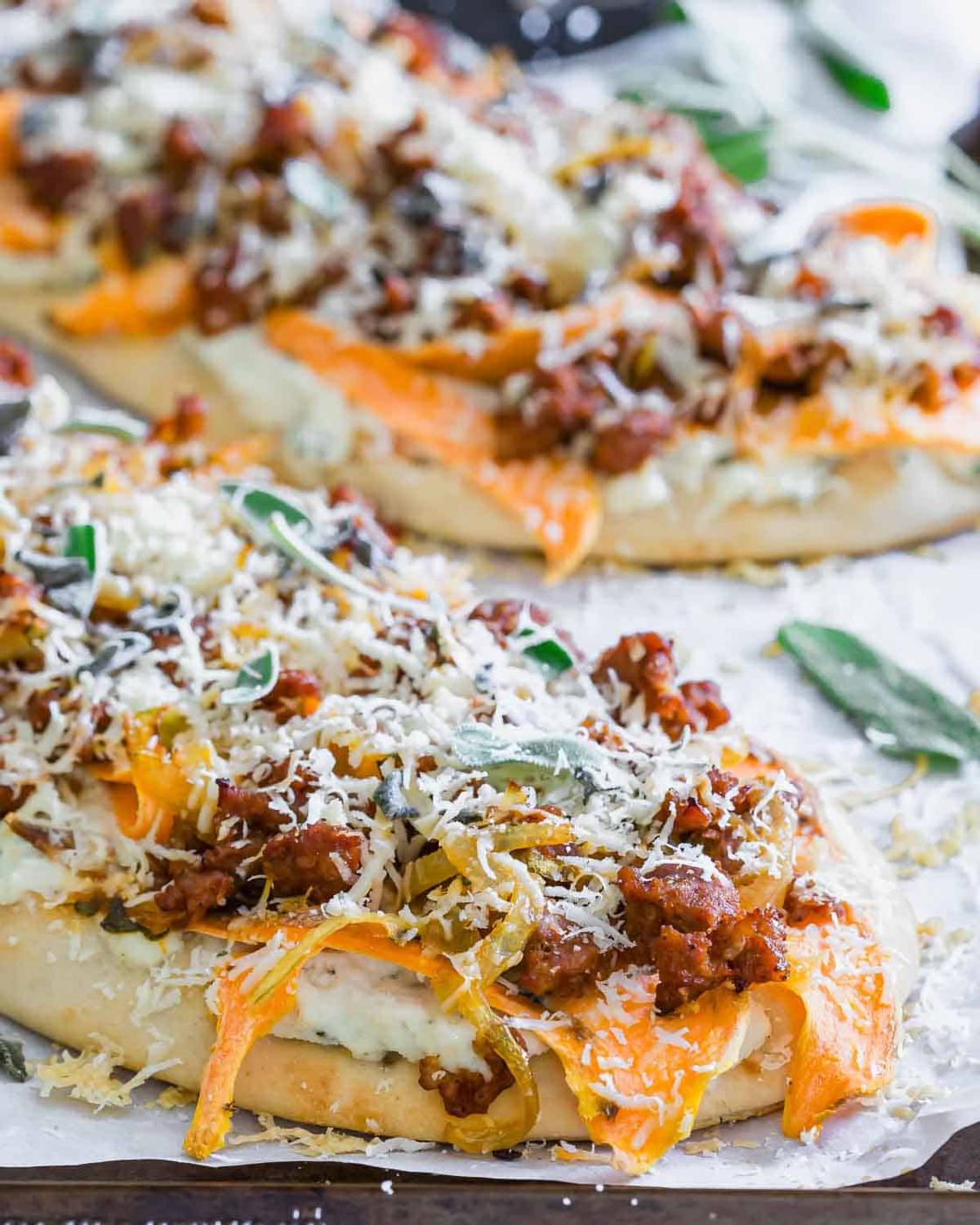 A pizza is sitting on a cutting board.