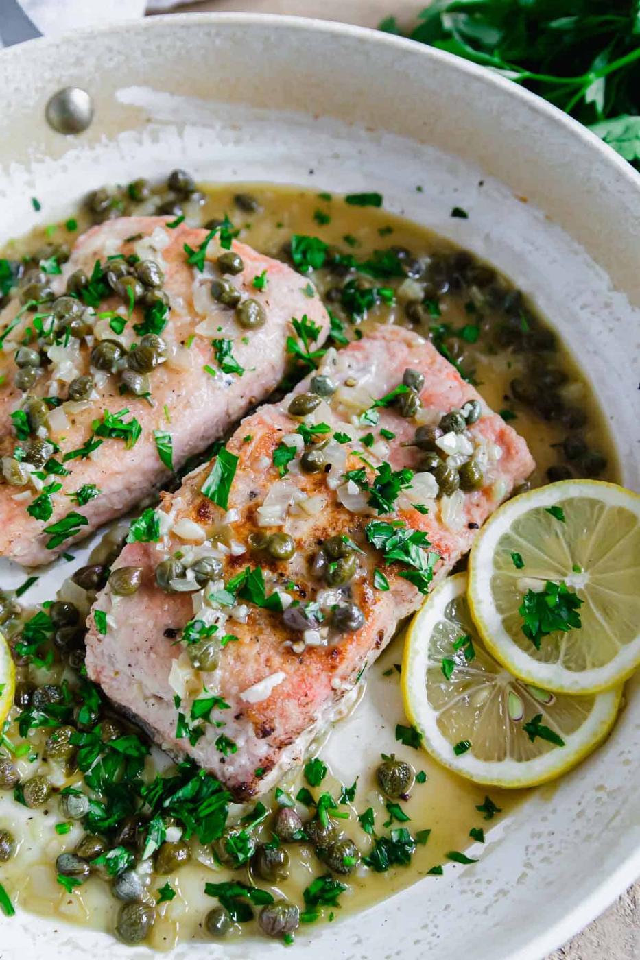 Salmon piccata recipe in a pan.