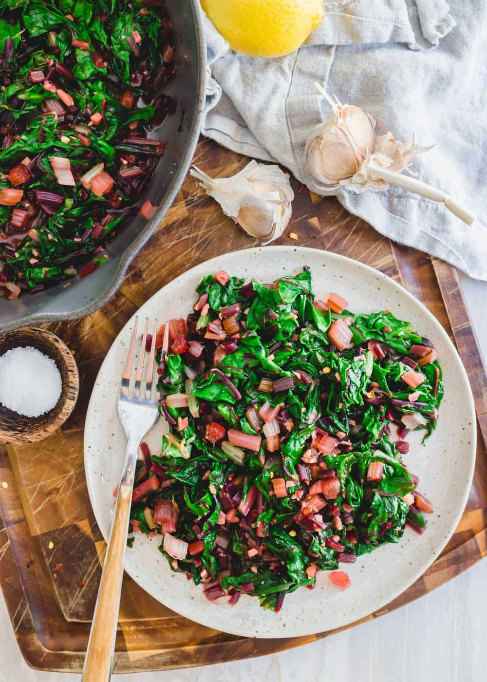 Plated recipe for sautéed greens with garlic and lemon zest.