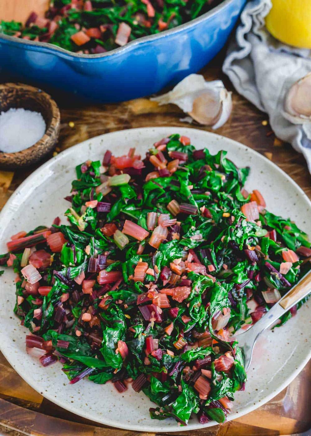 Finished recipe for sautéed beet greens and Swiss chard with stems, garlic and olive oil.