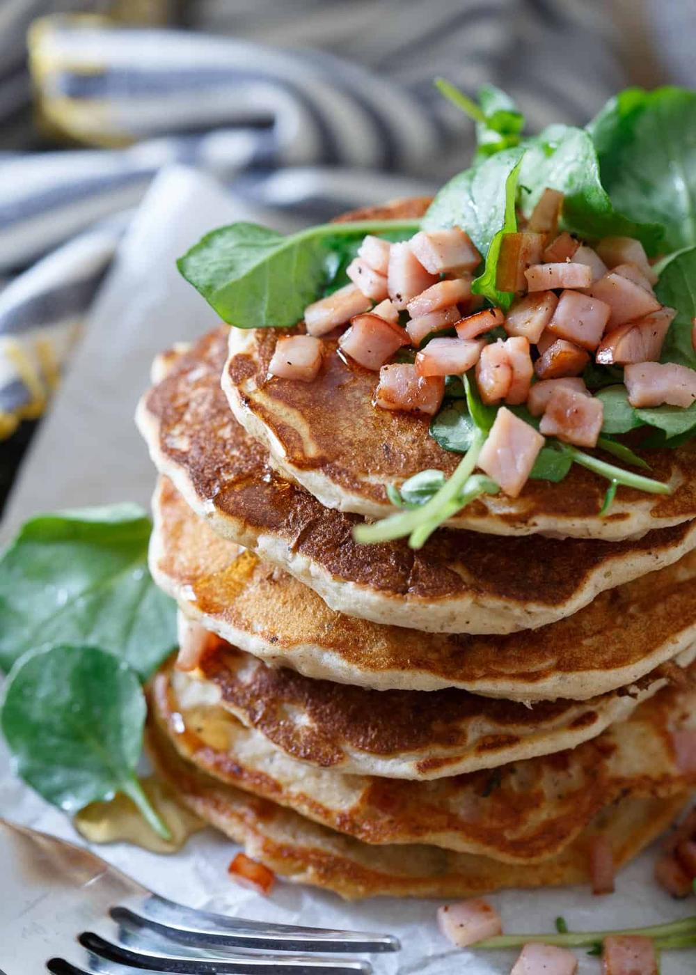 Savory Canadian Bacon Pancakes make the perfect breakfast for dinner meal. Stuffed full of savory ingredients and topped with a simple refreshing watercress salad.