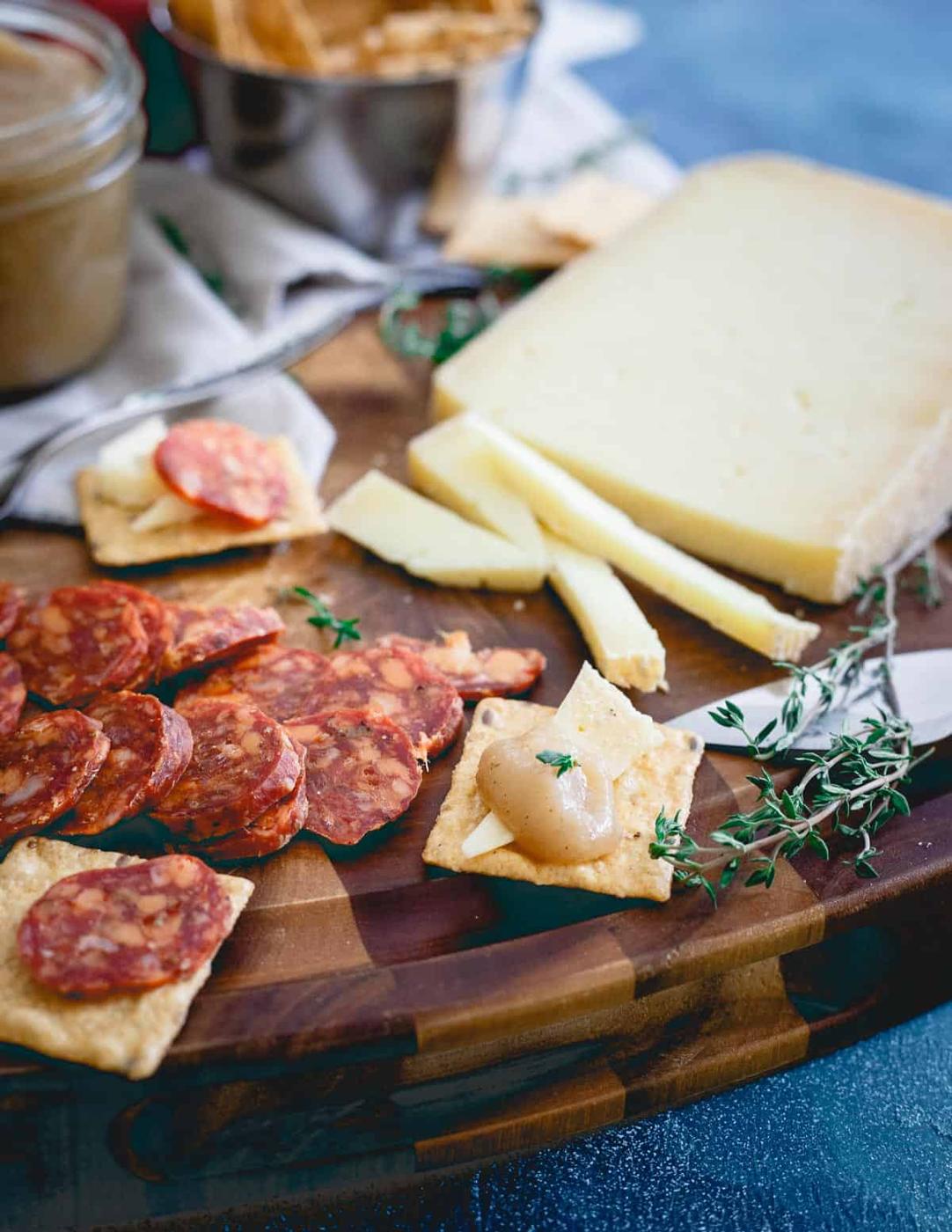 Multi-grain Crunchmaster cracker, sharp goat's milk cheese and a dollop of pear apple butter is the perfect fall bite.