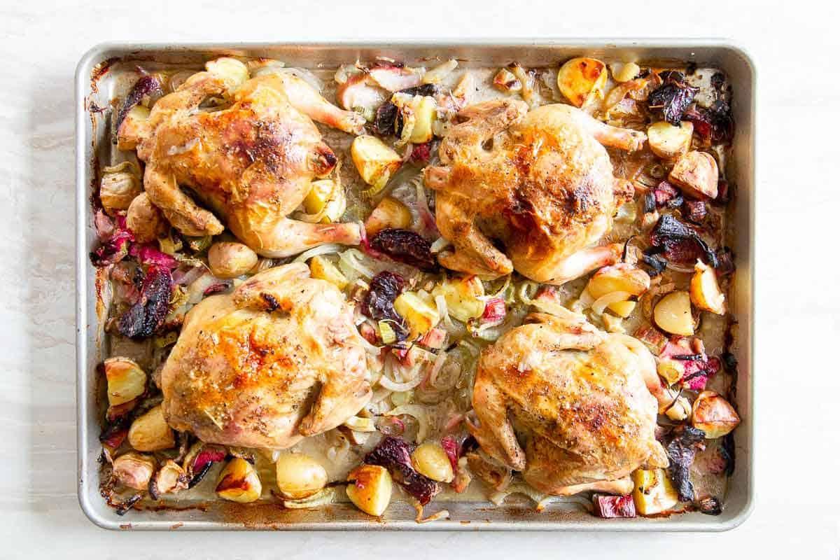 Cornish Game Hens are roasted to perfection on one sheet pan with blood oranges, fennel and potatoes for a delicious spring dinner.