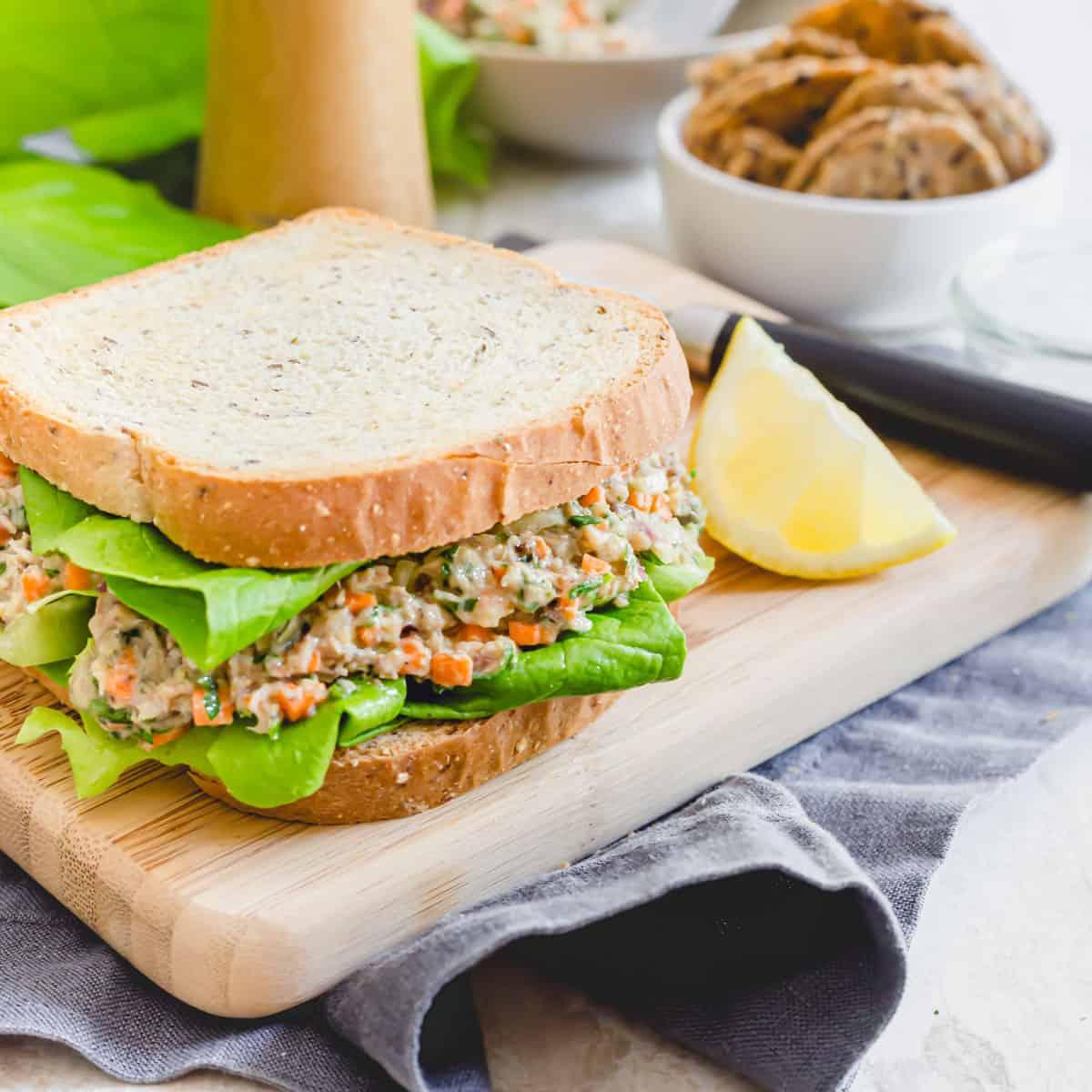 Sardine salad sandwich on gluten-free bread with fresh Bibb lettuce.