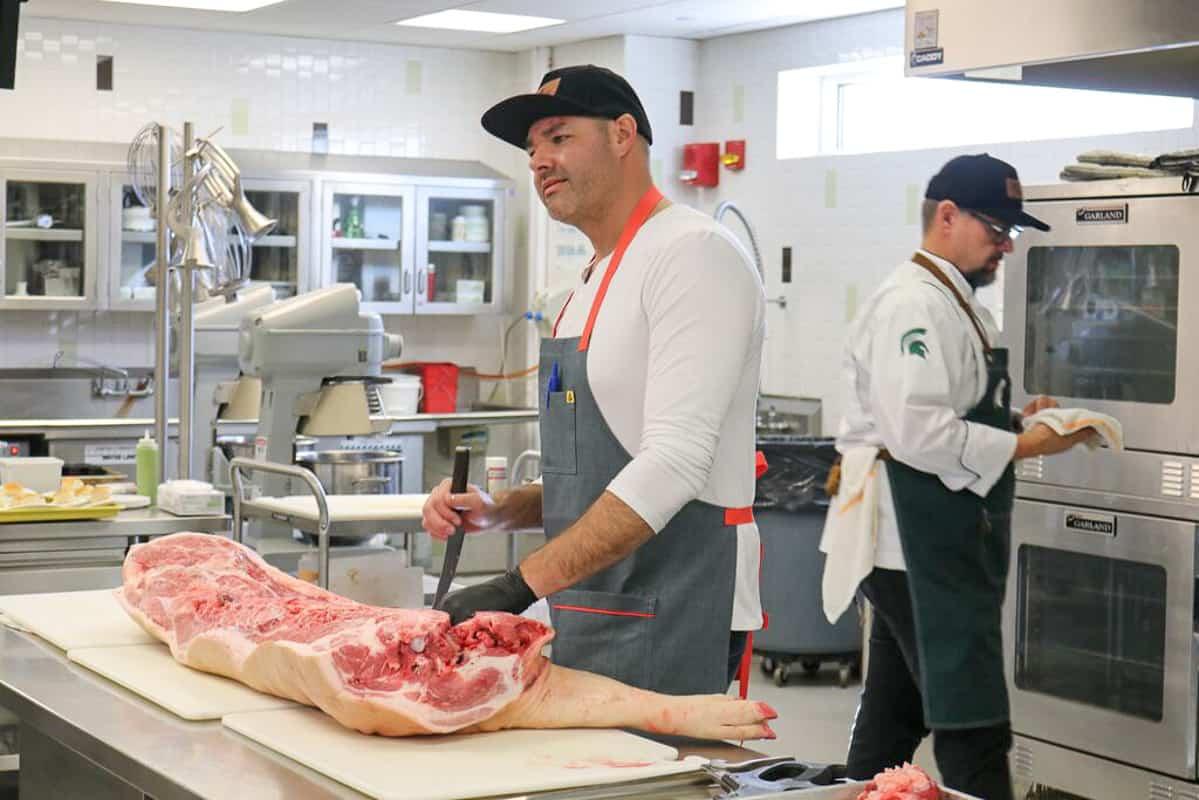 Learning how to break down a pig into different cuts of meat