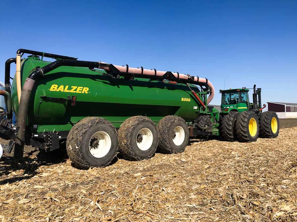 Fertilizer tractor and tank on a pig farm