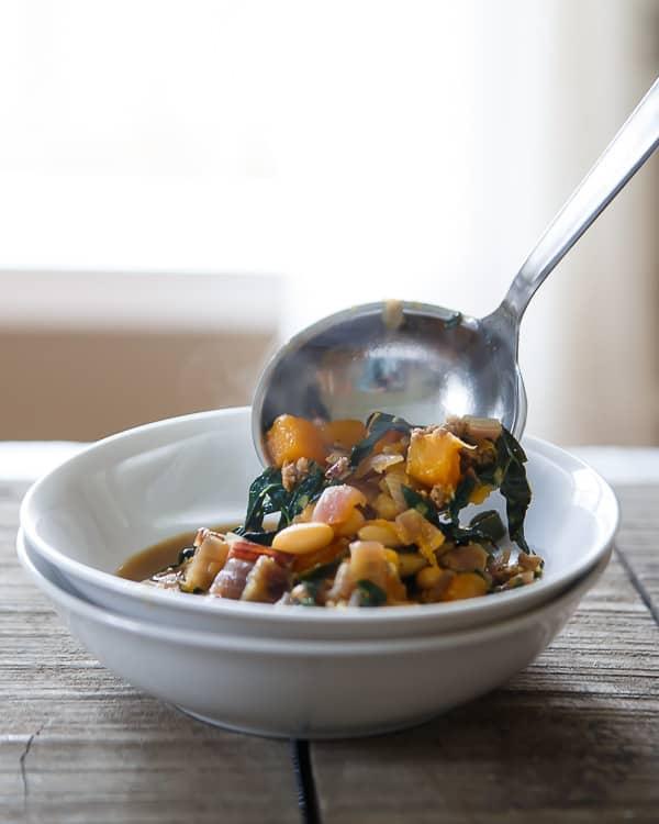 Spiced pork, butternut squash and white bean soup
