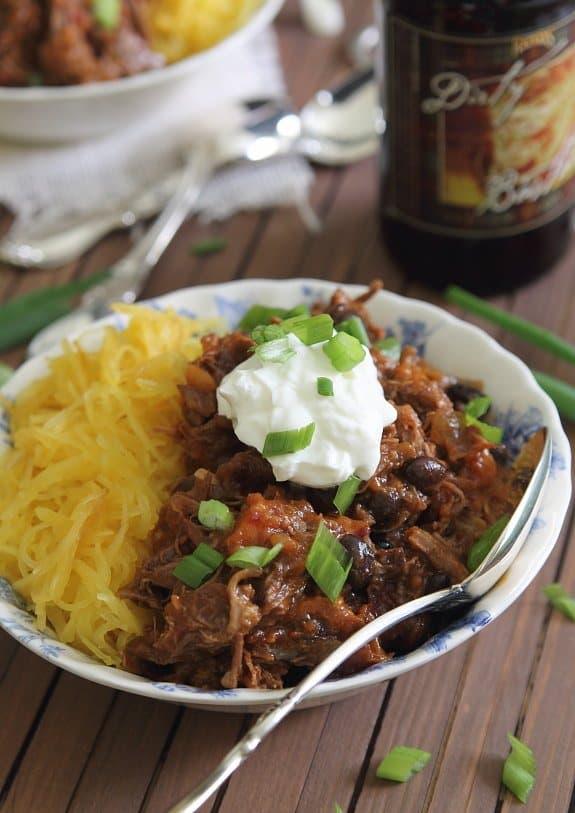 Cocoa Short Rib Chili made with guinness in a bowl with garnish
