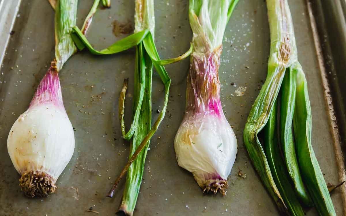 Roasted spring onions are part of this easy spring lamb nachos recipe.