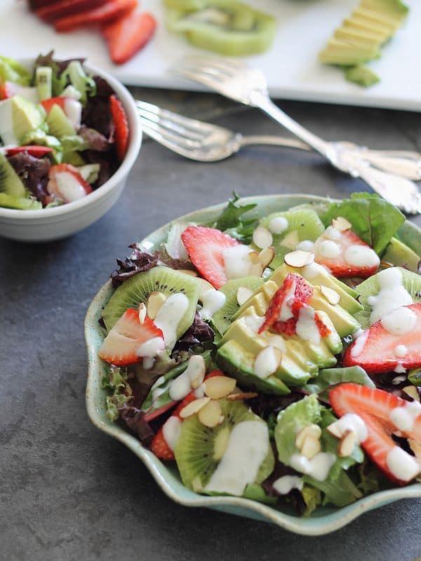 spring strawberry salad filled with avocados