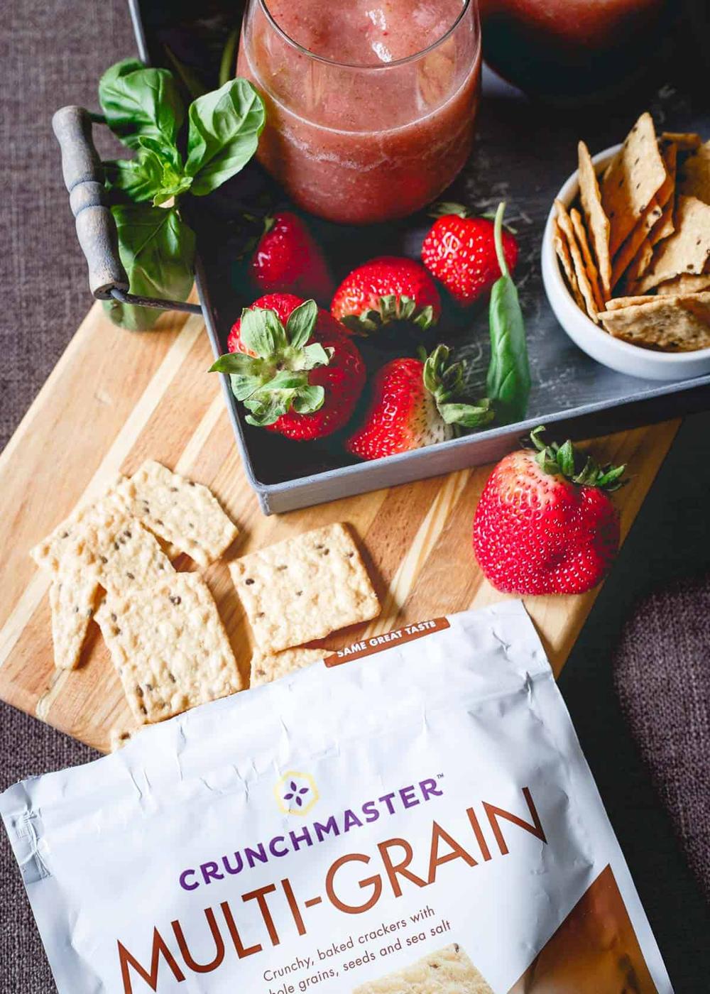 Strawberry Basil Cider Slushies are the perfect summer drink. Pair them with some gluten-free multi-grain Crunchmaster crackers for an easy happy hour!