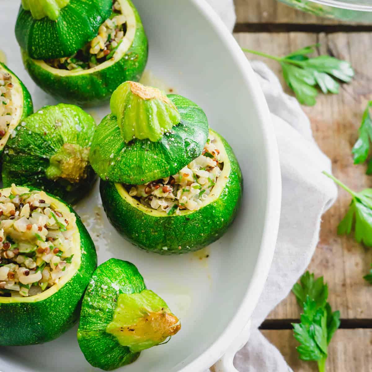Baked and stuffed Round de Nice (round zucchini) squash in a baking dish.