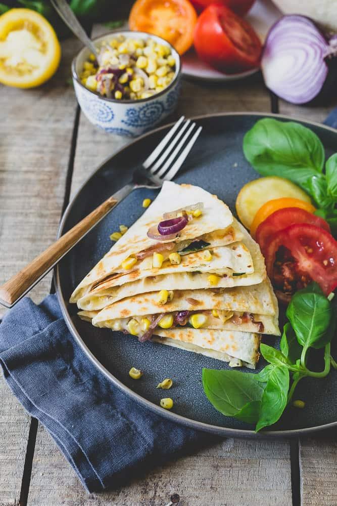Celebrate the best parts of summer with this easy quesadilla. Sharp cheddar melts over ripe tomatoes, sweet corn and basil for a simple meal.