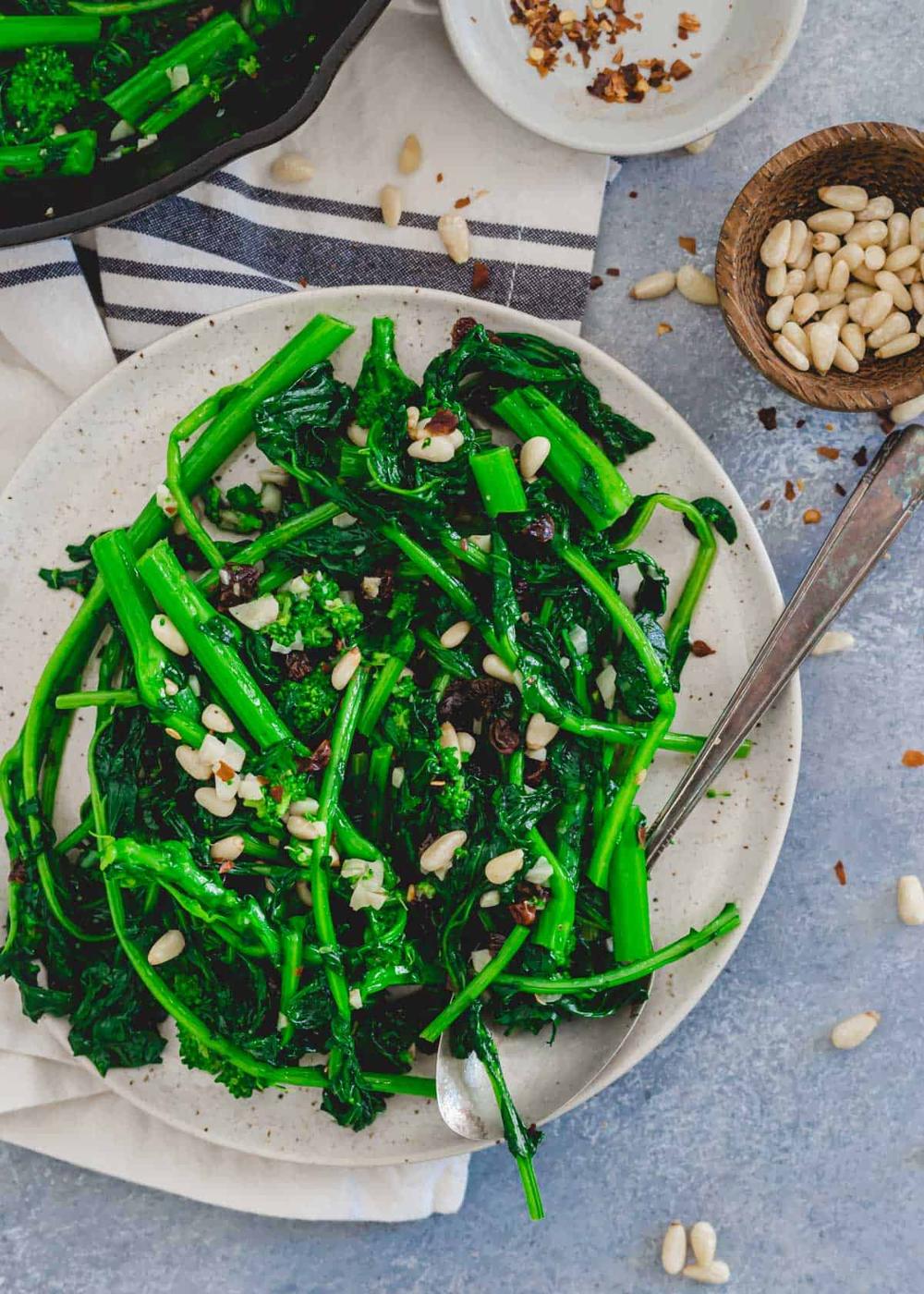 Easy broccoli rabe recipe on a plate with a spoon.