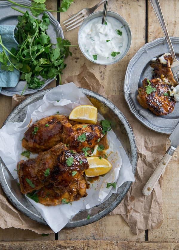 This sweet and spicy Indian chicken is marinated in yogurt and spices and finished with a sweet and sticky maple syrup glaze will easily become your go-to chicken dinner.