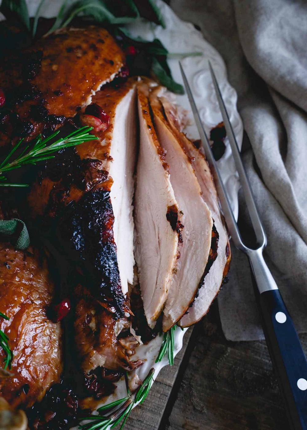 Tart cherry and cranberry juice create a sweet, sticky glaze that's perfect on this roasted organic heirloom turkey for Thanksgiving.