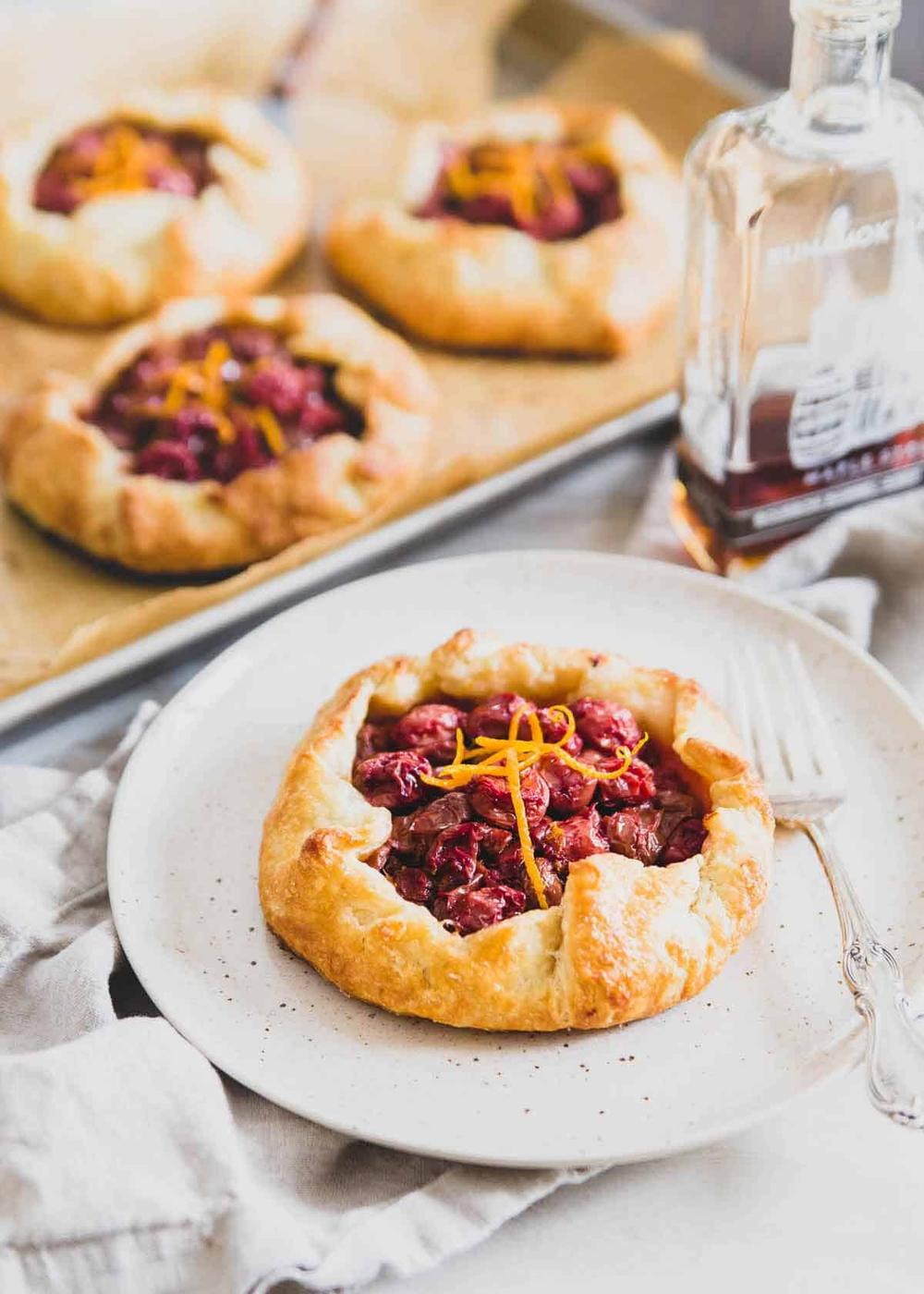 These cherry hand pies are filled with tart cherries, orange zest and sweetened with just a touch of maple syrup for a twist on the classic cherry pie.