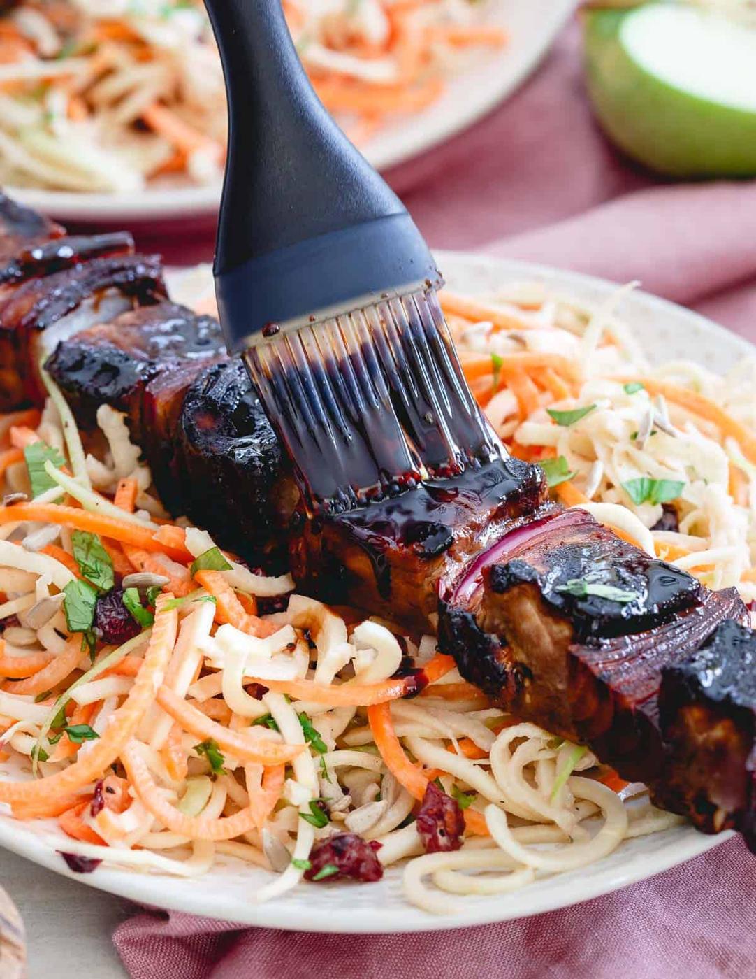 Tart cherry glaze gives these grilled Ahi tuna kabobs with red onions the perfect balance of sweetness over an easy spiralized winter salad.