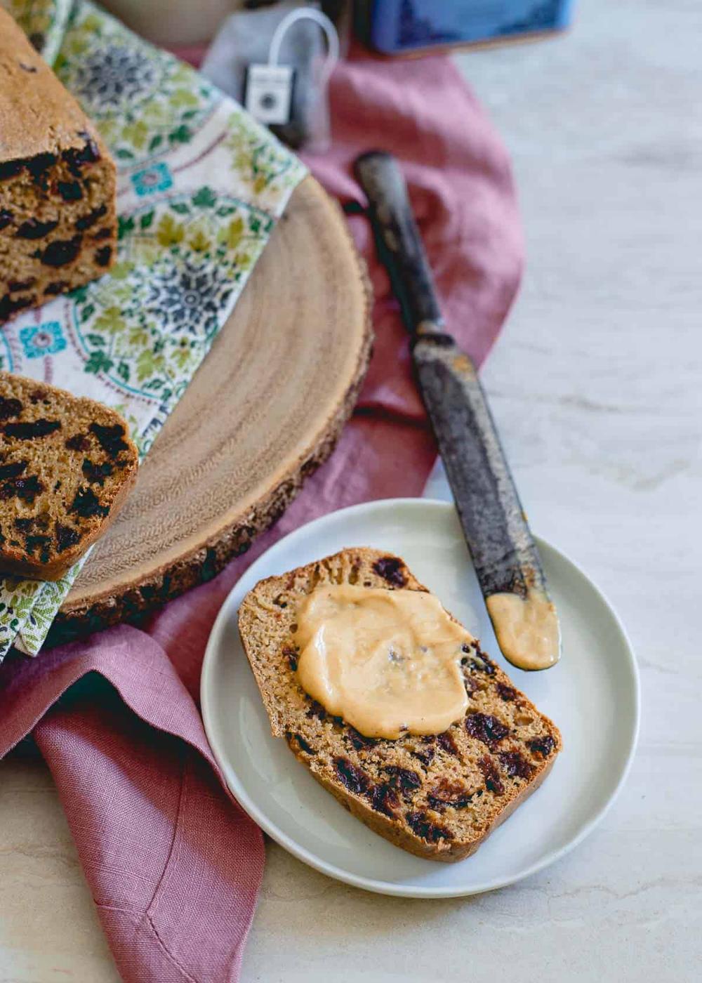 Spread some healthy nut butter on a piece of toasted tart cherry tea bread for a delicious snack option.